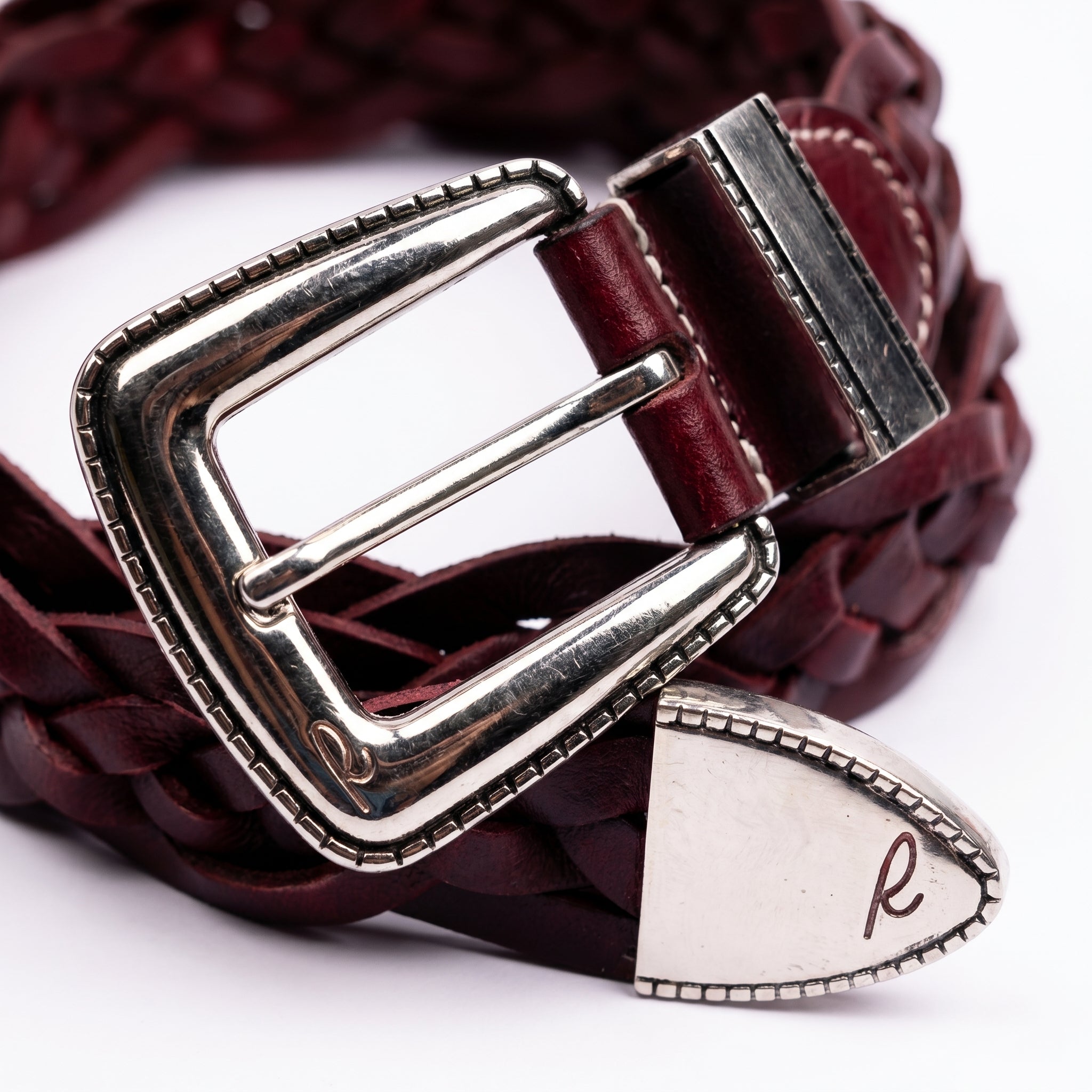 Rosso Windsor Nickel close-up showing handwoven red leather braid and polished nickel hardware detail