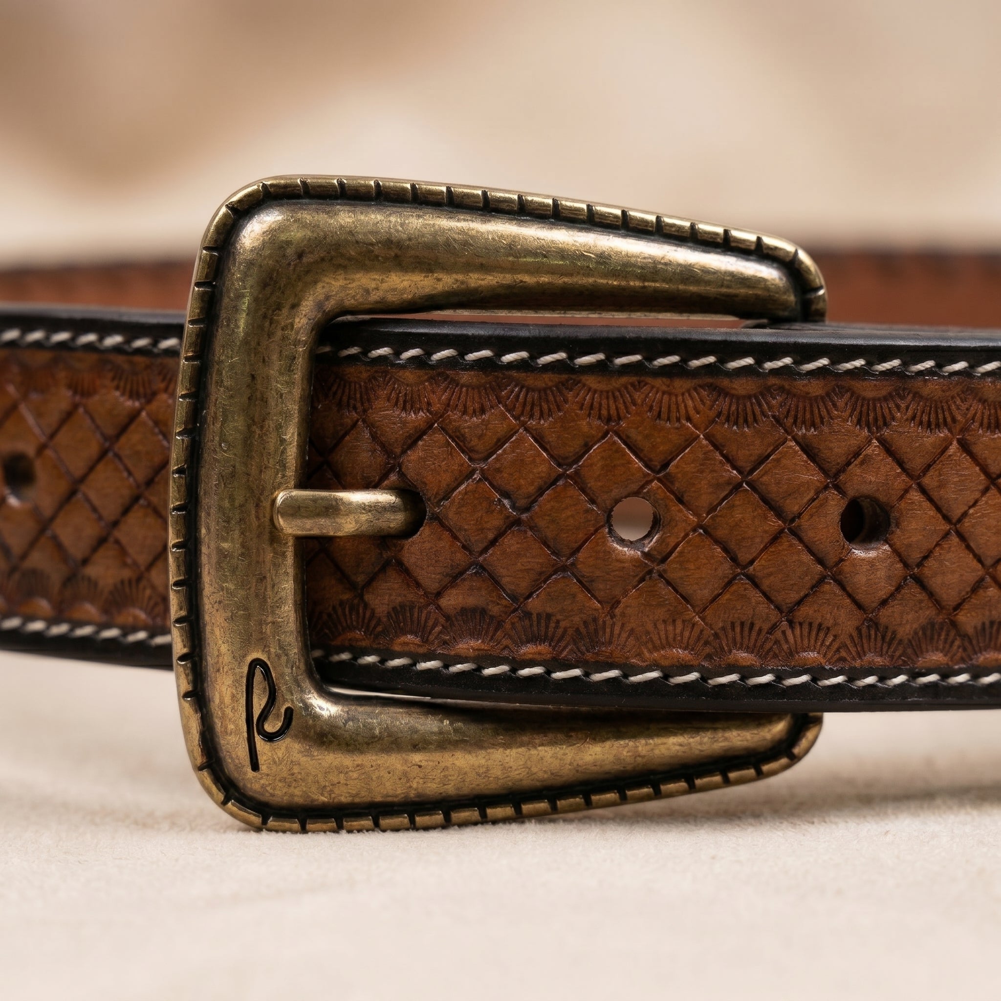 Dakota Basketweave Vintage antique brass buckle detail close-up with embossed leather keeper